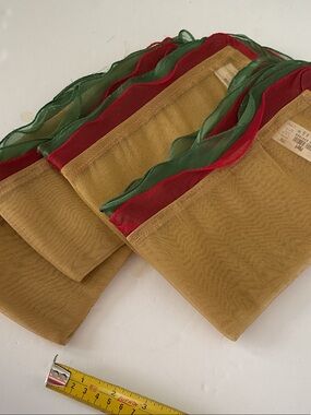 Pier 1 Gold table napkins with Red & Green Trim set of 4